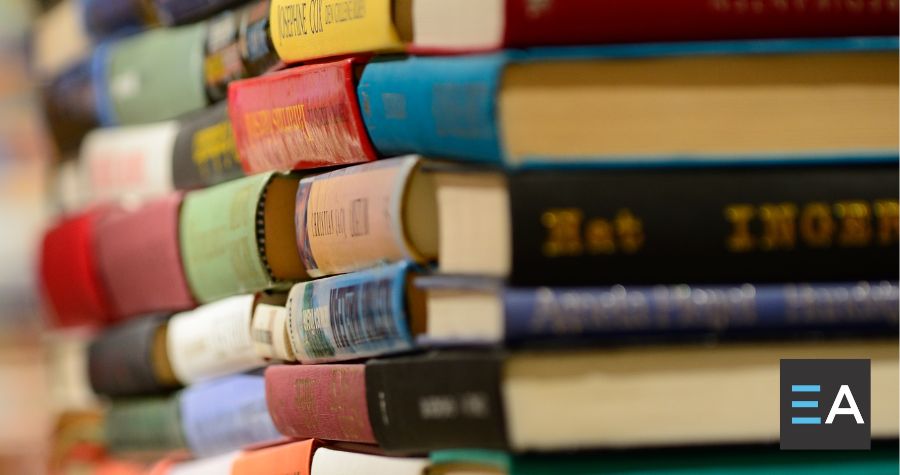 Several lined up stacks of books