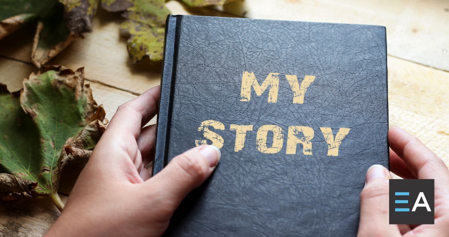 A person holding a book titled My Story