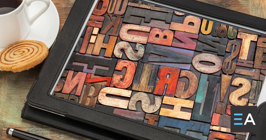 A box of multicolored typography letter tiles