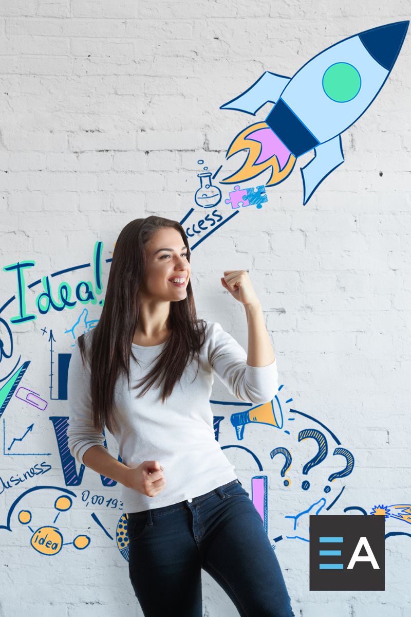 A person standing in front of a wall decorated with a painted rocket ship