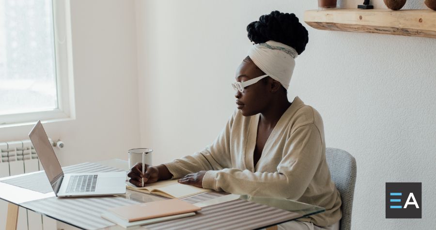 A person writing at a desk