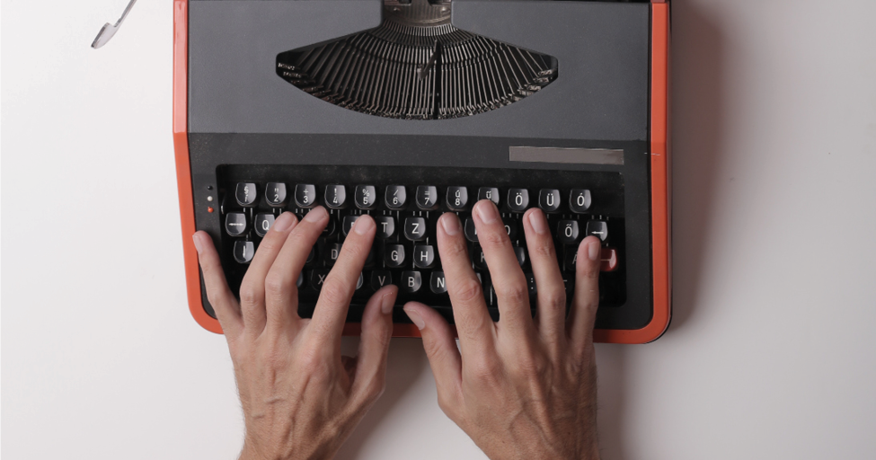 hands on a typewriter