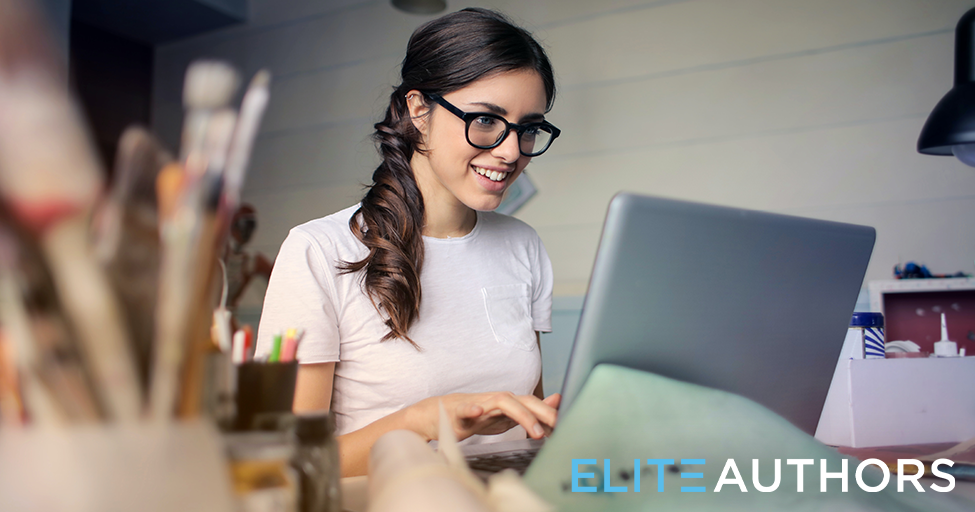 person smiling at computer