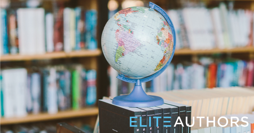 a globe stacked on some books with a bookshelf in the background