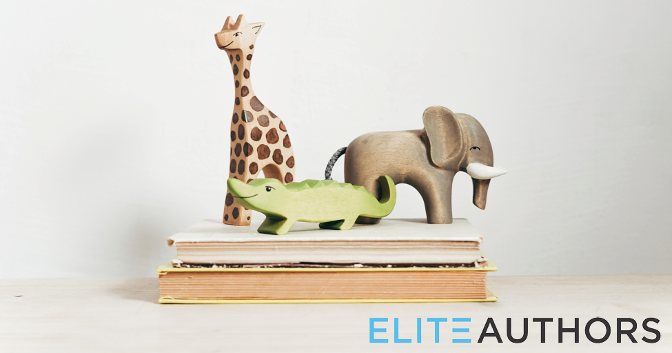 wooden animals on a book