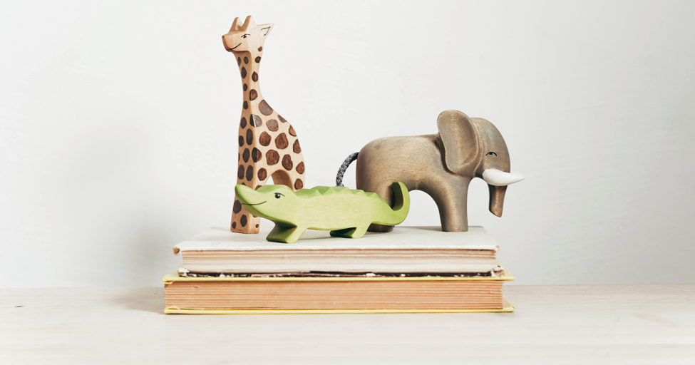 wooden animals on a book