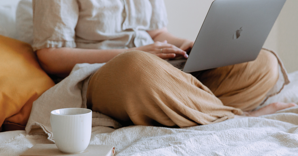 person sitting with laptop on lap