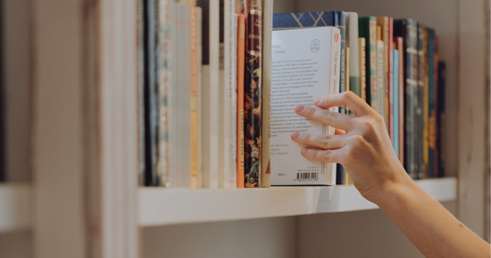 picking a book off a shelf