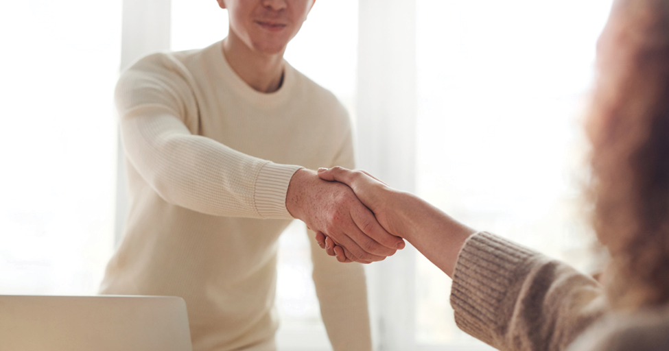 two people shaking hands